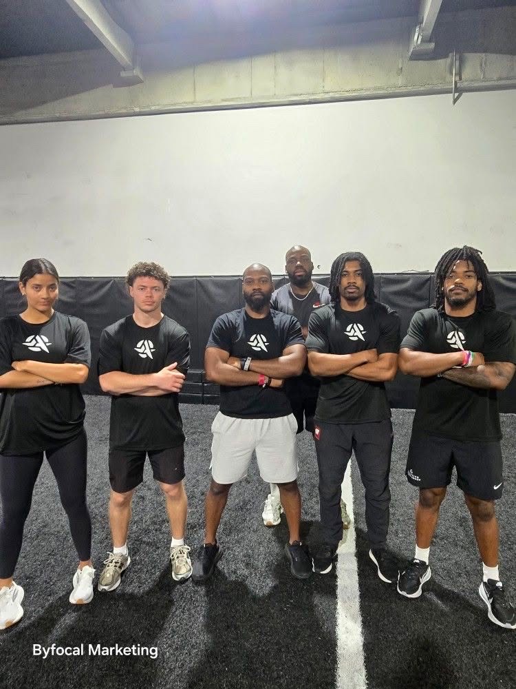 Armed Sports coaching team inside the facility